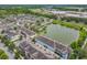 Aerial view features community pond, surrounding residences, and extensive green spaces at 1027 Cedar Bay Ln, Winter Springs, FL 32708