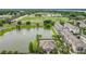 Community aerial view featuring the pond, clubhouse, and surrounding residences and green spaces at 1027 Cedar Bay Ln, Winter Springs, FL 32708