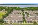 Aerial view of townhomes with screened-in porches, featuring well-maintained lawns and proximity to community parking at 1027 Cedar Bay Ln, Winter Springs, FL 32708