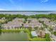 A community pool sits near lakefront townhomes, providing residents a refreshing place to relax at 1027 Cedar Bay Ln, Winter Springs, FL 32708