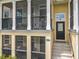 Charming townhome with a covered porch, black railings, and a welcoming entrance at 1027 Cedar Bay Ln, Winter Springs, FL 32708