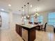 Kitchen with granite island, stainless steel appliances and pendant lighting at 1027 Cedar Bay Ln, Winter Springs, FL 32708