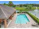 An outdoor community pool area offers a relaxing oasis with lake views and ample seating at 1027 Cedar Bay Ln, Winter Springs, FL 32708