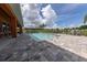 Community pool with lounge seating and a paved deck for residents' enjoyment at 1027 Cedar Bay Ln, Winter Springs, FL 32708