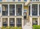 Close-up of a townhome screened porch with comfortable seating, offering a cozy outdoor living space at 1027 Cedar Bay Ln, Winter Springs, FL 32708
