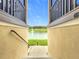 Scenic view of a tranquil lake with a fountain, framed by stucco walls and black railings at 1027 Cedar Bay Ln, Winter Springs, FL 32708