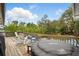Relaxing backyard deck with a hot tub, outdoor seating, and lush greenery, perfect for entertaining at 103 Cherry Hill Cir, Longwood, FL 32779