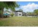 Spacious backyard featuring a boat parking area, well-maintained landscaping, and a pool at 103 Cherry Hill Cir, Longwood, FL 32779