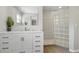 Beautiful bathroom featuring a stylish vanity, glass block shower, and contemporary fixtures at 103 Cherry Hill Cir, Longwood, FL 32779