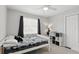 Cozy bedroom features a ceiling fan, carpet and a window, creating a relaxing space at 103 Cherry Hill Cir, Longwood, FL 32779