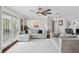 Bright living area featuring neutral decor, hardwood floors, and French doors to an outdoor space at 103 Cherry Hill Cir, Longwood, FL 32779