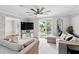 Comfortable living area features neutral tones, stylish furnishings, and access to an outdoor space at 103 Cherry Hill Cir, Longwood, FL 32779