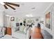 Spacious living area with hardwood floors, fireplace, and skylight provides a bright and inviting atmosphere at 103 Cherry Hill Cir, Longwood, FL 32779