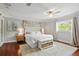 Bright main bedroom featuring a king bed, plush rug, and decorative details, creating a serene retreat at 103 Cherry Hill Cir, Longwood, FL 32779