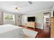 Spacious main bedroom boasts hardwood floors, ample closet space, and a tranquil atmosphere at 103 Cherry Hill Cir, Longwood, FL 32779