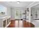 Bright office space with hardwood floors, storage, and a glass door leading to the outside at 103 Cherry Hill Cir, Longwood, FL 32779
