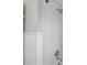 Close-up of a shower featuring white tiles, chrome fixtures, and a relaxing showerhead at 103 Cherry Hill Cir, Longwood, FL 32779