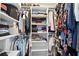 Well-organized walk-in closet with ample shelving, hanging rods, and storage for shoes and accessories at 103 Cherry Hill Cir, Longwood, FL 32779
