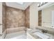 Bathroom with vanity, toilet and tiled shower at 108 N Truett St, Leesburg, FL 34748