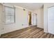 Bedroom features neutral walls, closet, window and modern floors at 108 N Truett St, Leesburg, FL 34748