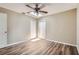 Room with modern floors, ceiling fan, skylight, and two doors at 108 N Truett St, Leesburg, FL 34748