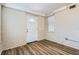 This room features modern flooring and an exit door to the outside at 108 N Truett St, Leesburg, FL 34748