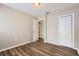 Cozy bedroom with wood-look floors, a closet, and natural light to give a relaxing retreat at 108 N Truett St, Leesburg, FL 34748