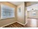 Bright room featuring modern wood floors and a large window for ample natural light at 108 N Truett St, Leesburg, FL 34748