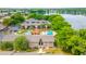 Aerial photograph of lakefront condo community featuring pool and meticulously kept green spaces at 1177 Paseo Del Mar # D, Casselberry, FL 32707