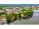Aerial view of community with lake access, a pool, and mature trees at 1177 Paseo Del Mar # D, Casselberry, FL 32707