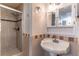 Bathroom featuring a walk-in shower and a vanity at 1177 Paseo Del Mar # D, Casselberry, FL 32707
