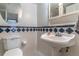Classic bathroom with vanity, mirror, and blue and white tile accents at 1177 Paseo Del Mar # D, Casselberry, FL 32707
