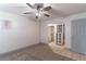 Bedroom featuring a ceiling fan and an attached walk-in closet at 1177 Paseo Del Mar # D, Casselberry, FL 32707