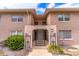 Inviting condo exterior featuring a charming entrance with stairs and well-maintained landscaping at 1177 Paseo Del Mar # D, Casselberry, FL 32707