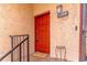 Inviting front door with a bright red color and modern digital lock at 1177 Paseo Del Mar # D, Casselberry, FL 32707