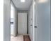 Bright hallway featuring a storage closet with views into the kitchen area at 1177 Paseo Del Mar # D, Casselberry, FL 32707