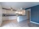 Kitchen with white cabinets, tile flooring, and an eat-in breakfast bar at 1177 Paseo Del Mar # D, Casselberry, FL 32707