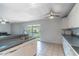 Open floor plan showcases a spacious kitchen with a breakfast bar and stainless steel sink at 1177 Paseo Del Mar # D, Casselberry, FL 32707