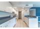 Well-lit kitchen with white cabinets and tile flooring at 1177 Paseo Del Mar # D, Casselberry, FL 32707
