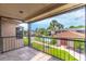 Spacious balcony showcasing views of lush landscaping and community features at 1177 Paseo Del Mar # D, Casselberry, FL 32707