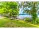 Beautiful waterfront view featuring serene lake and charming wooden dock at 1177 Paseo Del Mar # D, Casselberry, FL 32707