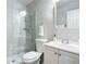 Updated bathroom featuring tiled walls, glass shower, modern fixtures, and white vanity at 1201 S Beach Cir, Kissimmee, FL 34746