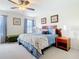 Inviting bedroom with stylish furnishings, a bed with floral comforter, and ample natural light at 1201 S Beach Cir, Kissimmee, FL 34746