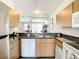 Functional kitchen with stainless steel appliances, and granite countertops at 1201 S Beach Cir, Kissimmee, FL 34746