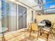 Covered patio featuring tiled floors, outdoor furniture, and sliding glass doors at 1201 S Beach Cir, Kissimmee, FL 34746