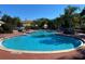 Large community pool with several distinct sections and comfortable lounge seating for residents at 1201 S Beach Cir, Kissimmee, FL 34746