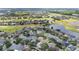Aerial view highlighting the property's location near a golf course and lake at 1319 Castleport Rd, Winter Garden, FL 34787