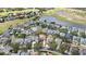 Aerial view showcasing the property's location near a lake and golf course at 1319 Castleport Rd, Winter Garden, FL 34787