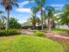 Well-maintained backyard with tropical landscaping and tranquil rock water feature at 1319 Castleport Rd, Winter Garden, FL 34787