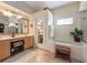 Bright bathroom featuring vanity, jacuzzi tub, and tile floors at 1319 Castleport Rd, Winter Garden, FL 34787